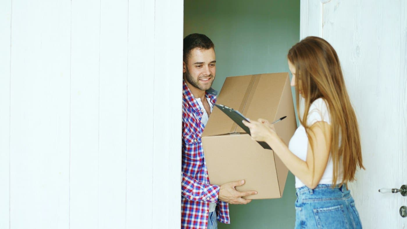 A couple receiving a delivery at their door