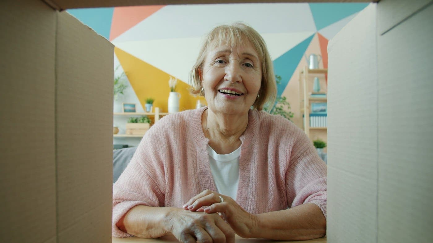 A smiling customer on a video call at home